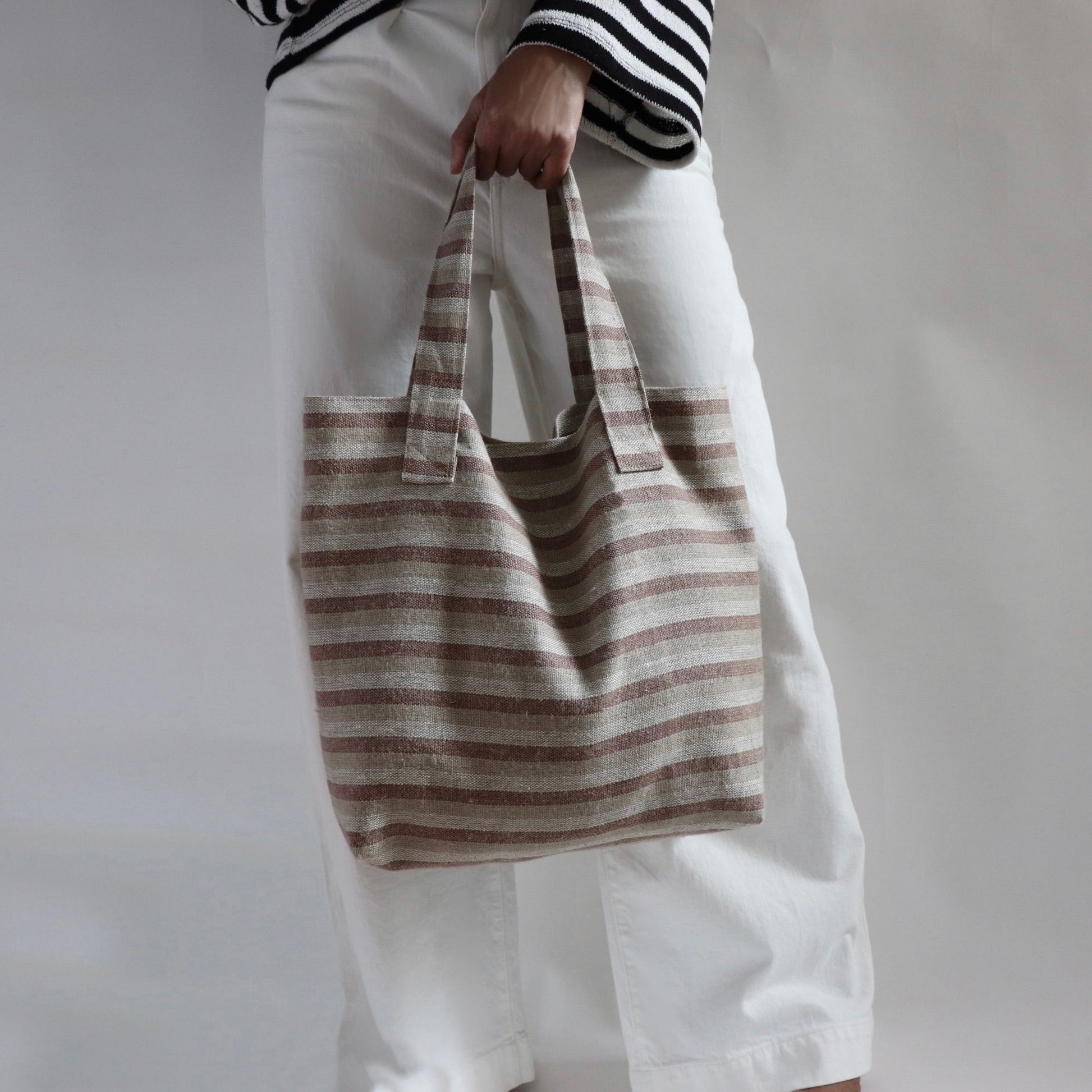 Lifestyle photo of Beach bag in striped woven linen