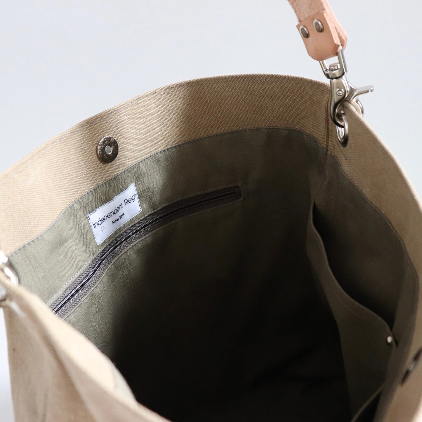Interior bag lining with zipper pocket and slip pockets