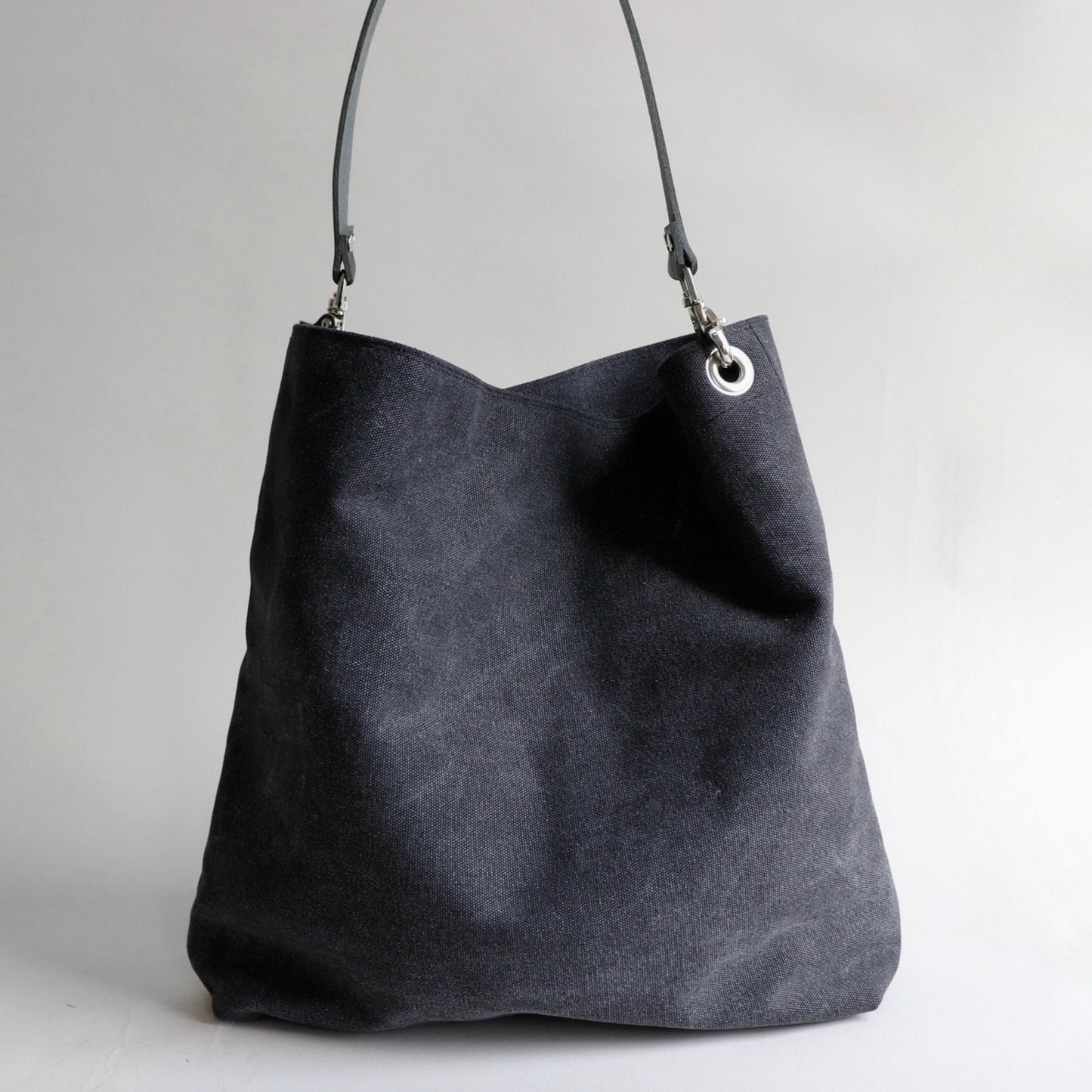 Back view of of slouchy gray hobo tote bag