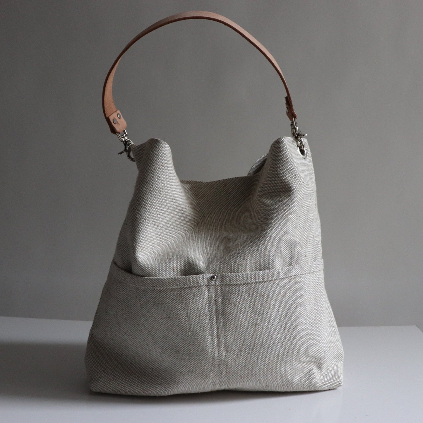 slouchy shoulder bag in natural woven flax 