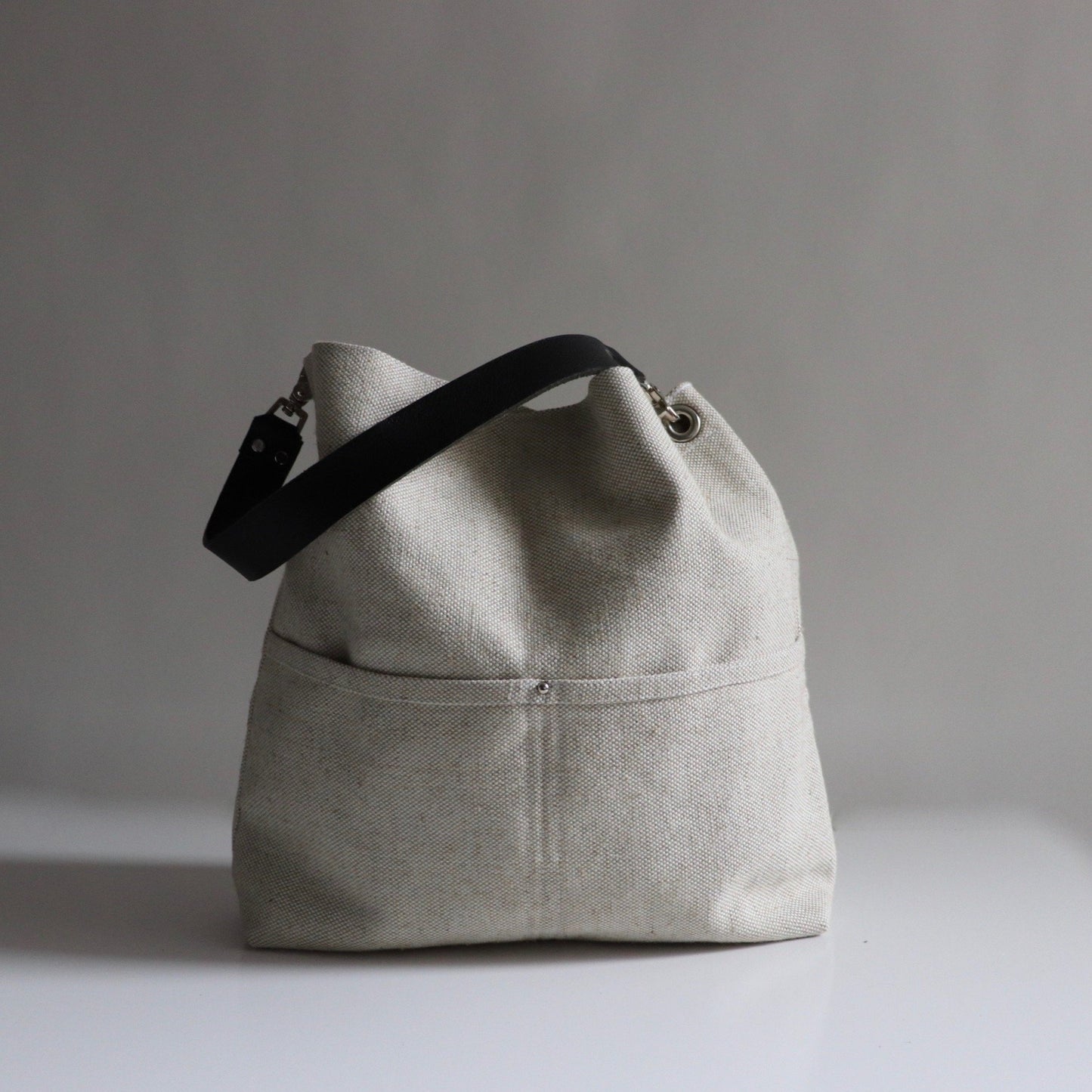 Woven flax bucket bag  main front view 