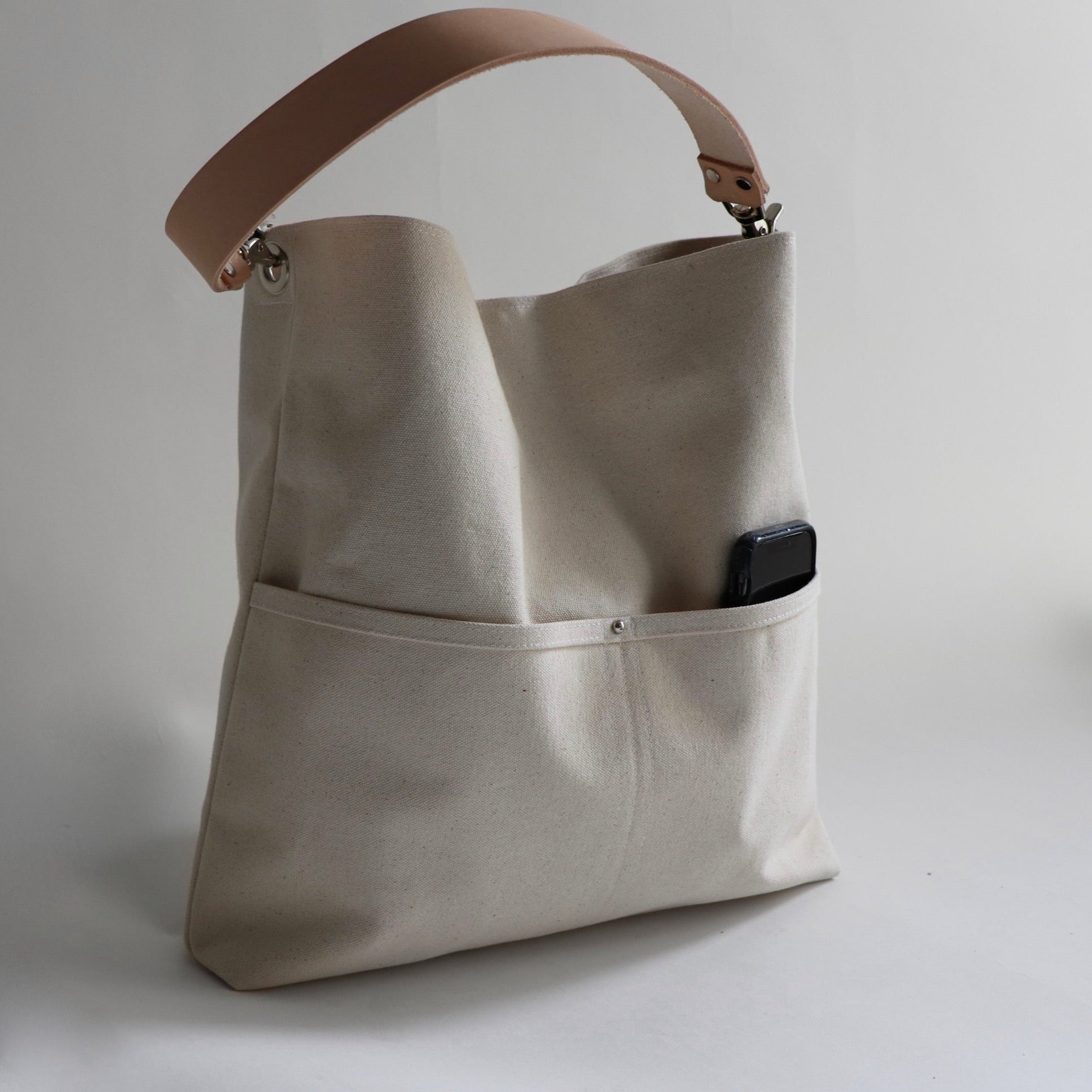 side view of canvas shoulder bag