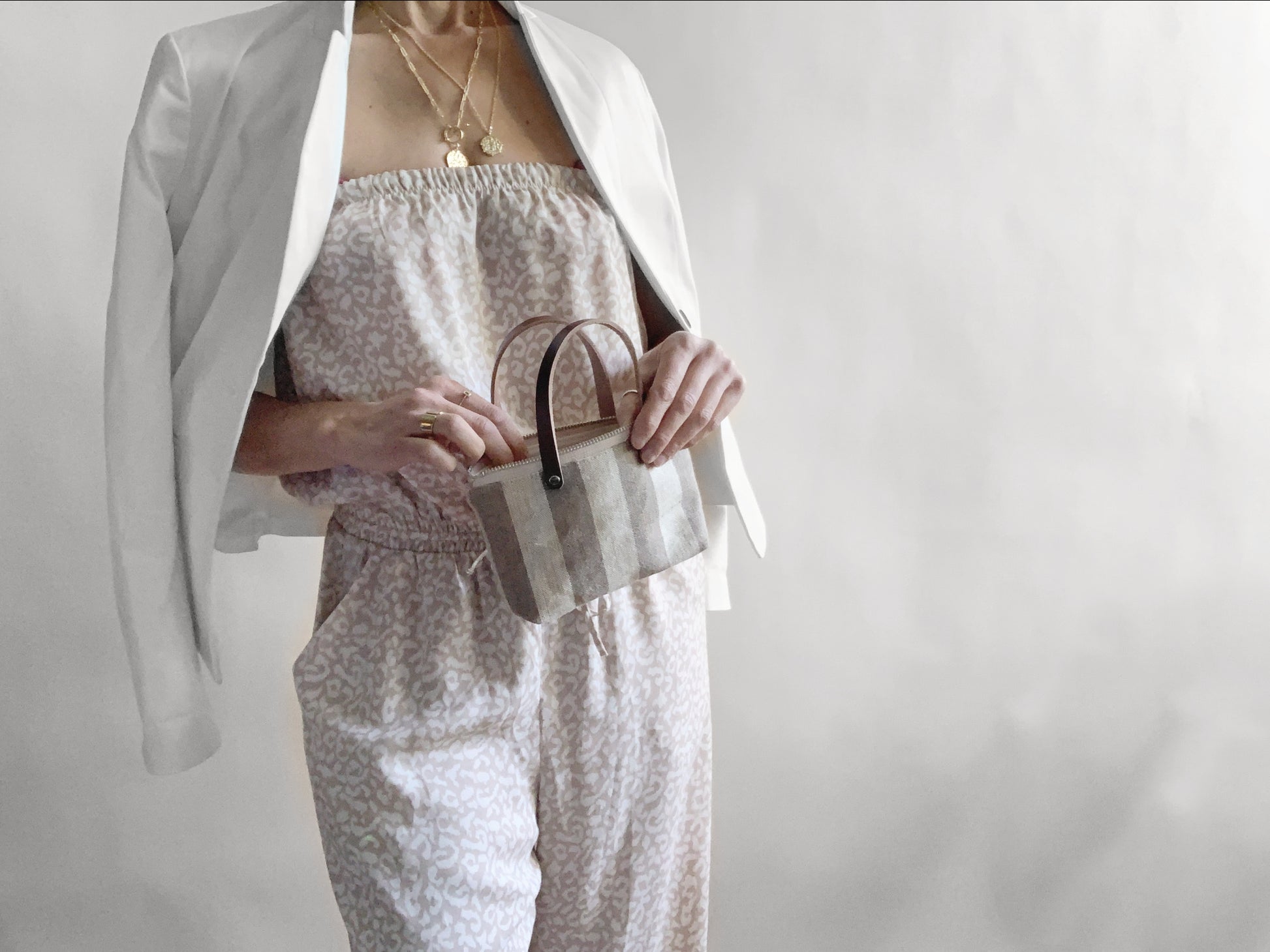 Model holding mini tote bag