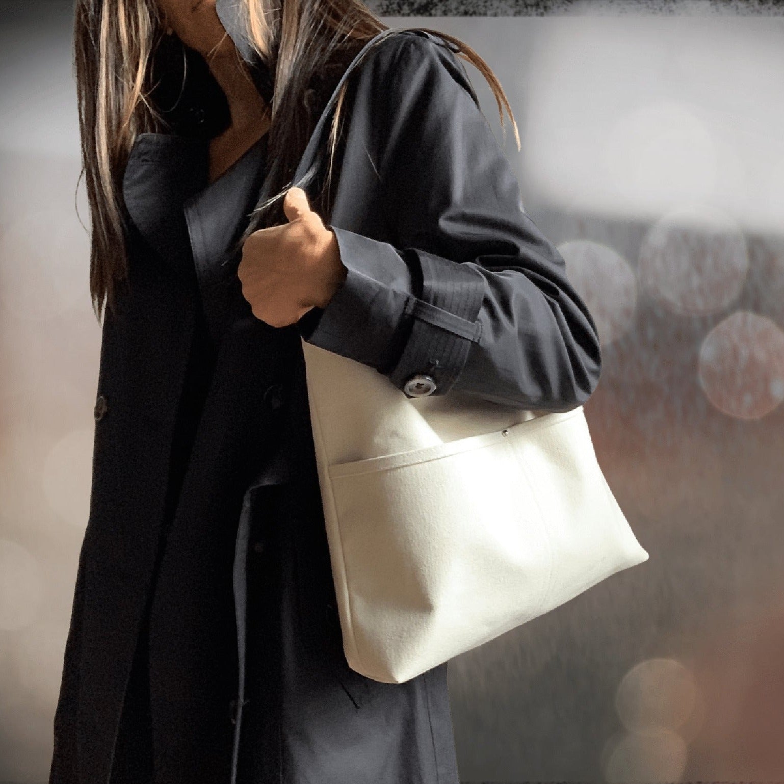 Model with hobo style shoulder bag