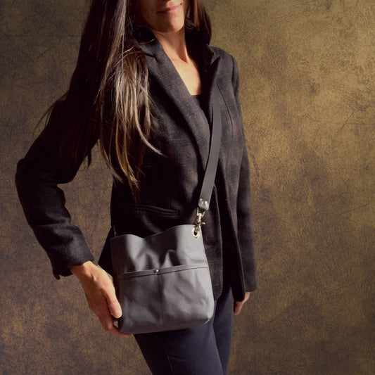 Model with small canvas crossbody bag